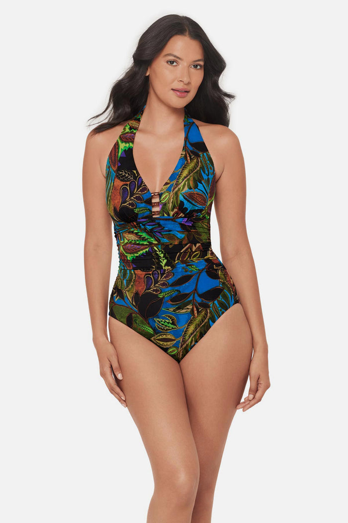 Woman wearing a multicolored abstract printed one-piece swimsuit