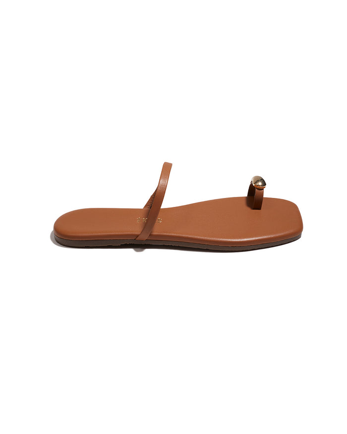 Side view of a single natural TKEES Colette Sandal showing the slim silhouette.