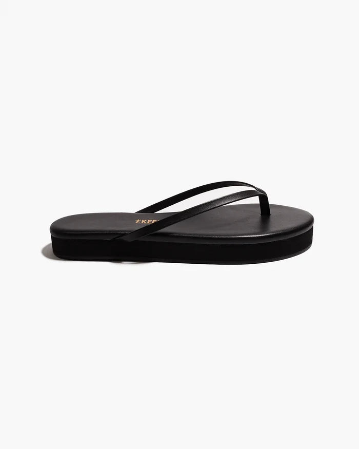 Side view of a single black TKEES Lily Platform Sandal showing the platform heel height.