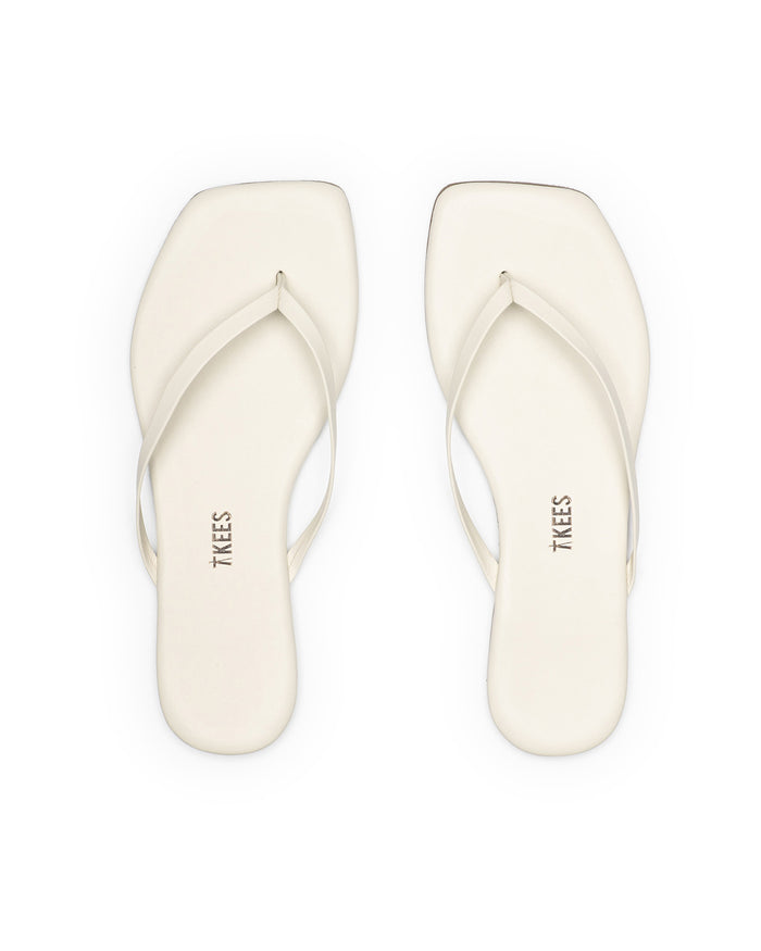 Top view of the TKEES Square Toe Lily Sandals in cream.