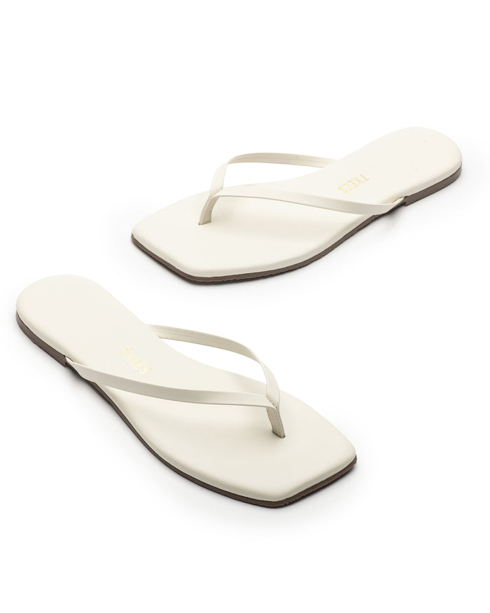 Off-model angled view of the TKEES Square Toe Lily Sandals in cream.