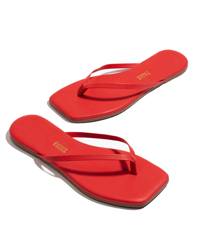 Off-model angled view of the TKEES Square Toe Lily Sandals in red.