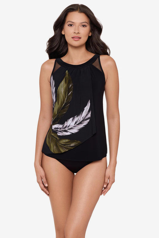 Woman wearing a green and white feather printed tankini top with mesh detail