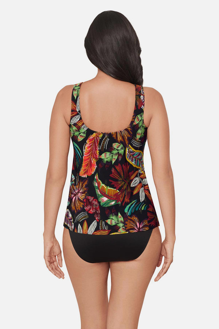 Woman turned away wearing a multicolored floral printed tankini top with mesh details