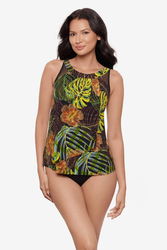 Woman wearing a multicolored palm leaf printed tankini top