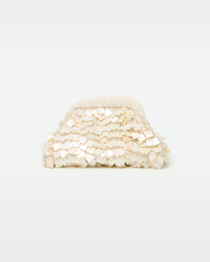 Front view of the Vienna Clutch in cream, showing a dome-shaped clutch covered in layered iridescent cream shell paillettes with a beaded top frame clasp.