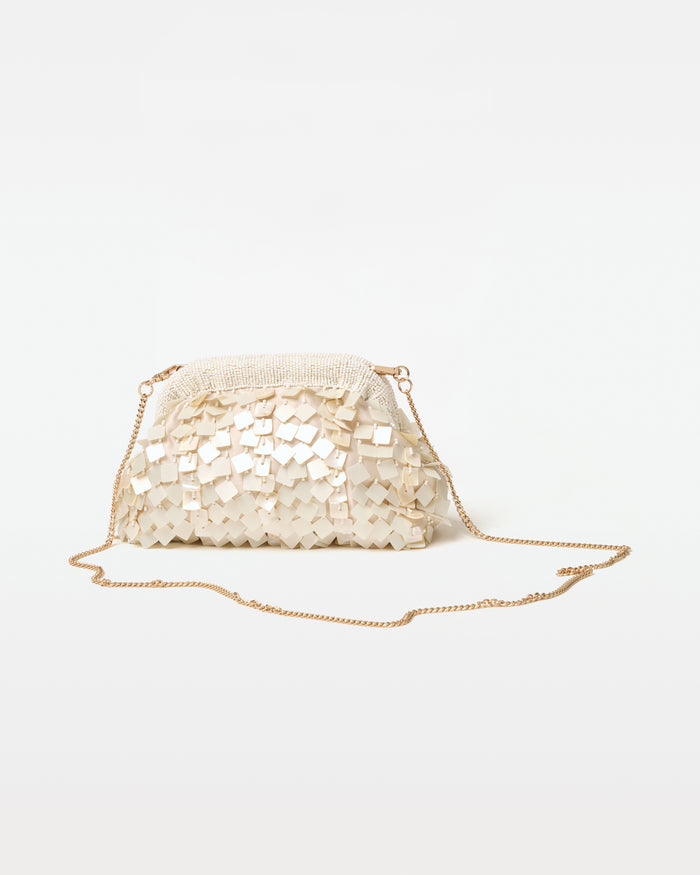 Front view of the Vienna Clutch in cream with the gold chain crossbody strap displayed.