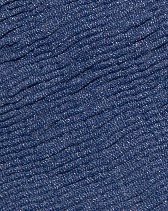 Close-up fabric detail of the LSPACE Midnight Blue pucker swimwear fabric, showing navy diagonal ribbing with subtle metallic shimmer.