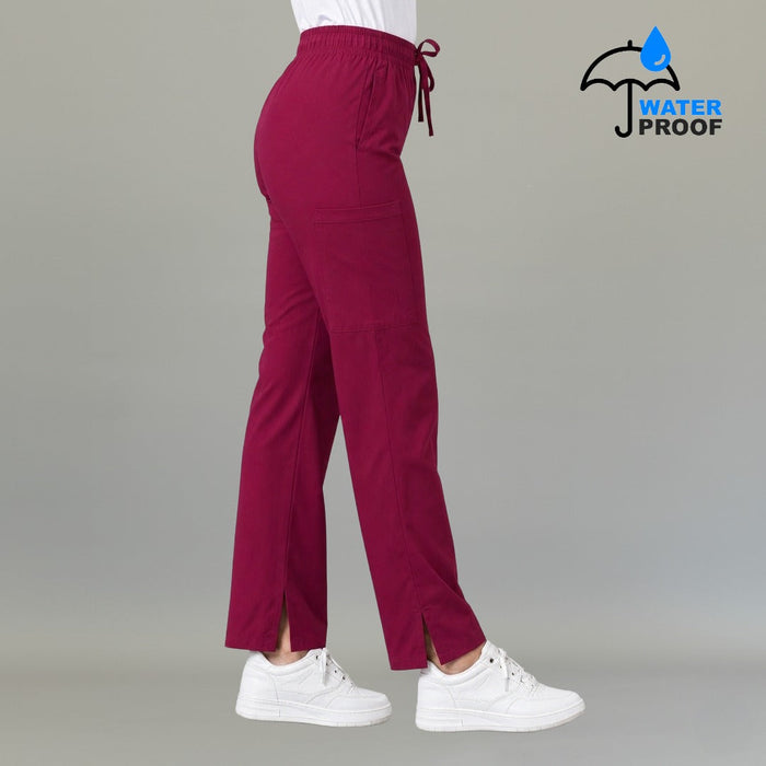 Women's 502 Fuchsia wide-leg scrub pants, rear side view with slit hem visible