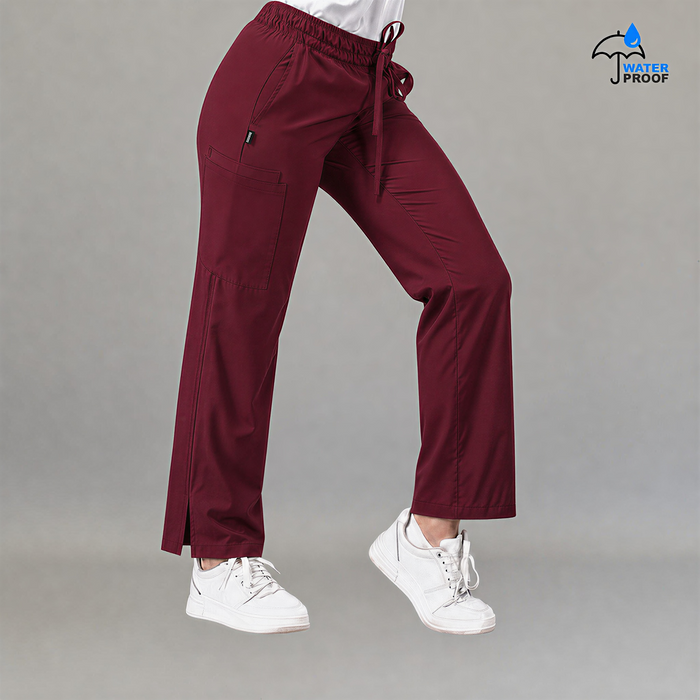 Side view of women's 502 maroon scrub pants showing cargo pocket and side slit hem — lightweight fluid-resistant nursing pants by S-FOR-ME