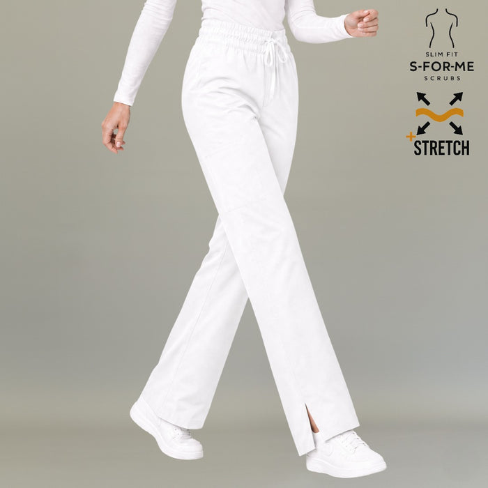 Women's white 502 relaxed scrub pants in a walking pose, showing the drawstring waist and straight legs