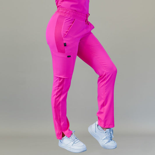 Women's Style 530 Fuchsia relaxed-fit scrub pants, rear three-quarter view with weight on the back leg