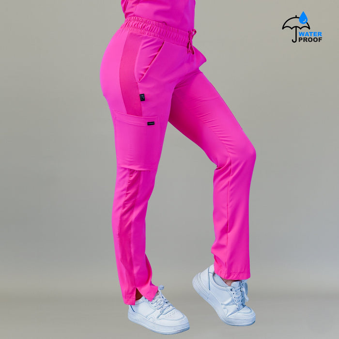 Women's Style 530 Fuchsia relaxed-fit scrub pants, rear three-quarter view with side pocket visible