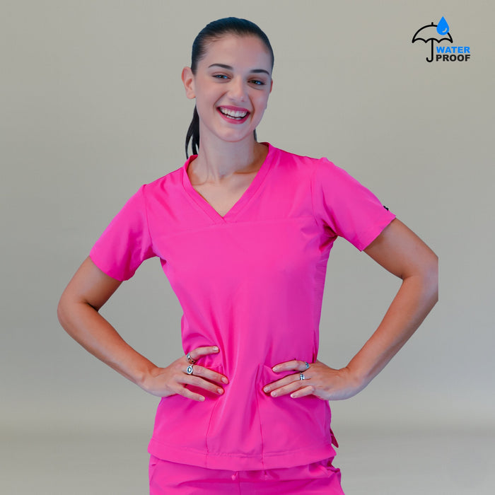 Women's Style 530 Fuchsia scrub top, smiling front view