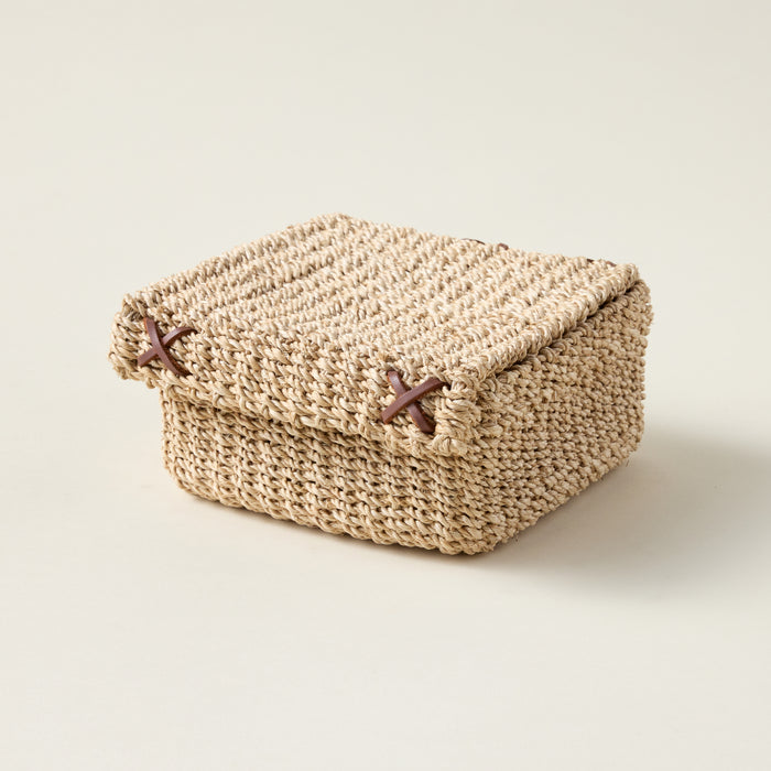 Boho-inspired woven basket for cocktail napkins.
